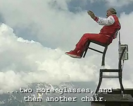 Man balances chair over cliff for 65th birthday